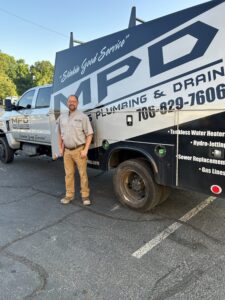 Charles standing in front of MPD Work Truck